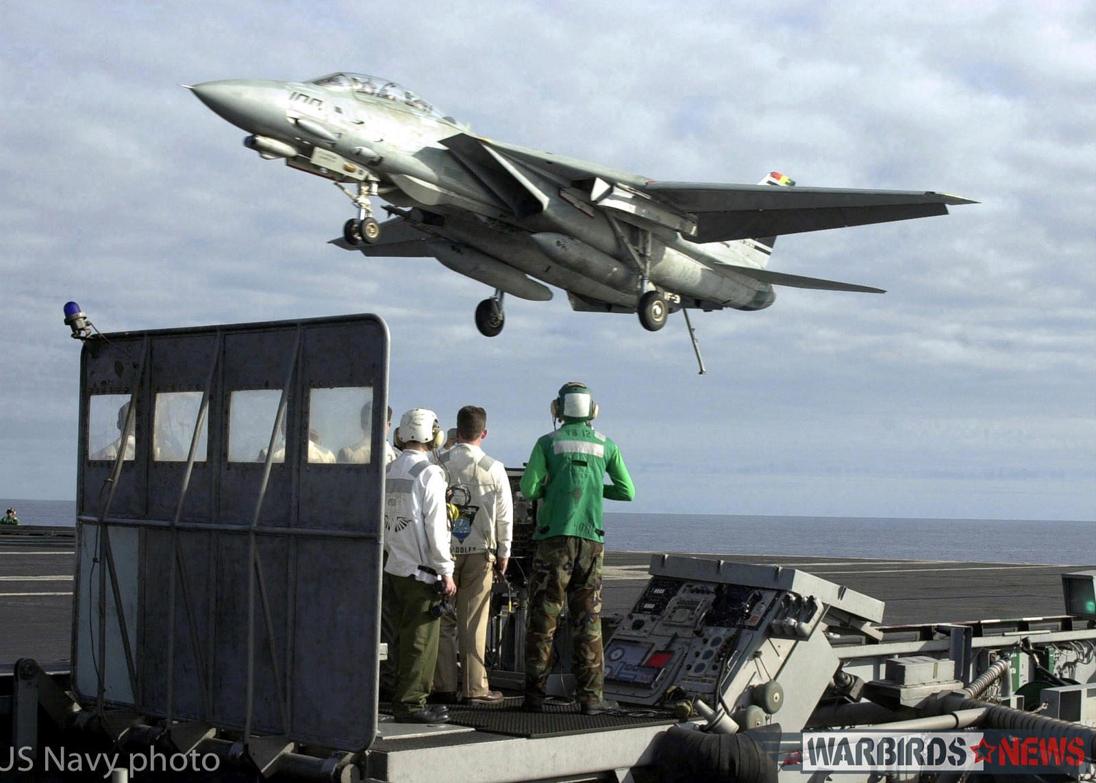 Aboard USS Abraham Lincoln (Jan. 26, 2001) -- An F-14D "Tomcat" from the "Tomcatters" of Fighter Squadron Three One (VF-31) flies over the Landing Signal Officer (LSO) platform aboard USS Abraham Lincoln (CVN 72) after returning from a successful proficiency flight. The Lincoln is on her final leg of a scheduled six-month deployment to the Arabian Gulf in support of Operation Southern Watch. U.S. Navy photo by Photographer's Mate 2nd Class Daniel Wolsey. (RELEASED)