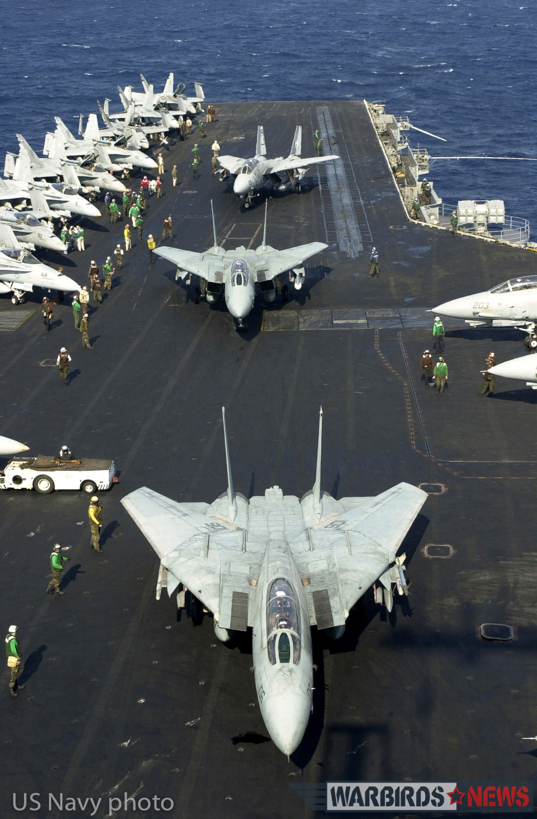 Aboard USS Enterprise (CVN 65) Nov 9, 2001-- F-14 Tomcats prepare to take off from the flight deck of USS Enterprise a final time. This was the last time the 34 year-old aircraft will be deploying on the carrier. USS Enterprise (CVN 65) is returning to her homeport in Norfolk, Virginia after completing a six-month deployment. U.S. Navy Photo by Photographer's Mate 1st Class, Martin Maddock. (RLEASED)
