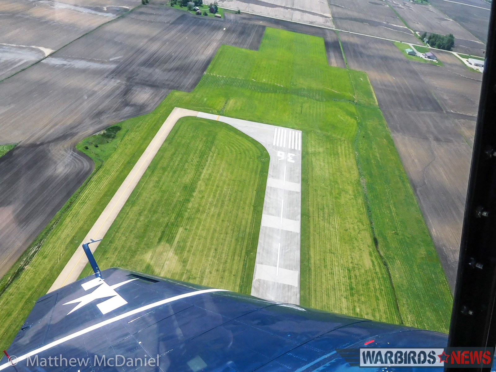 Looking down at the approach end of VYS's runway 36, during a left overhead break for landing on Runway 25. (Photo by Matthew McDaniel)