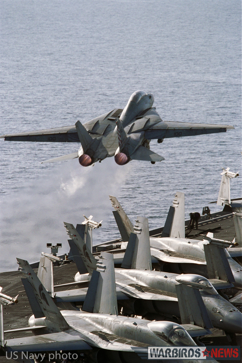At sea aboard USS John C. Stennis (CVN 74) Mar. 27, 2002 - An F-14A "Tomcat" from the "Checkmates" of Fighter Squadron Two One One (VF-211) launches off the flight deck. Carrier Air Wing Nine (CVW-9) and John C. Stennis are deployed in support of Operation Enduring Freedom. U.S. Navy photo by Photographer's Mate 3rd Class Jayme T. Pastoric. (RELEASED)
