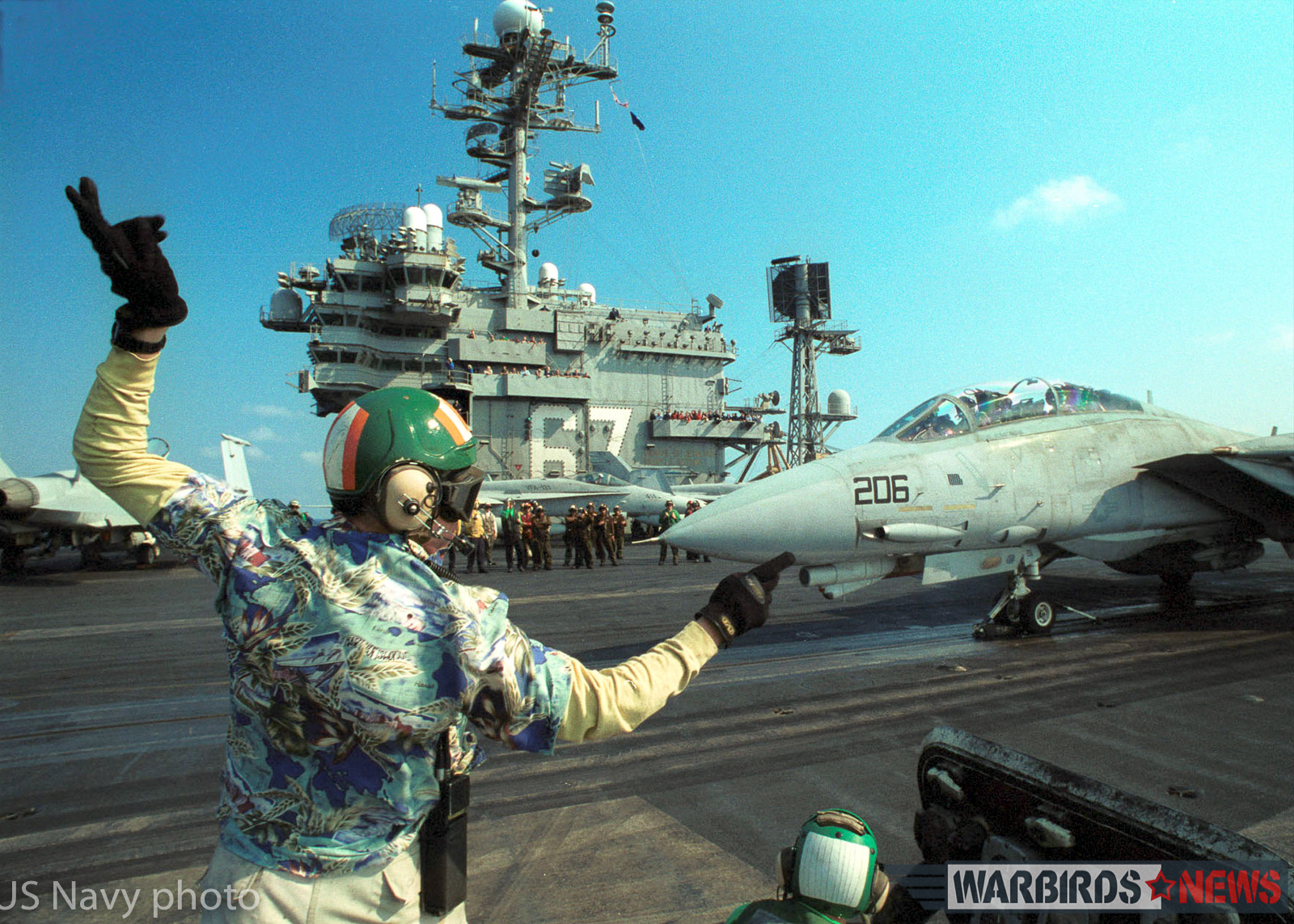 At sea aboard the aircraft carrier USS John F. Kennedy (CV 67) Aug. 14, 2002 -- The Landing Signals Officer prepares to give the signal to launch An F-14B “Tomcat” assigned to the "Red Rippers" of Fighter Squadron One One (VF 11). Launching from the flight deck of USS John F. Kennedy, the Tomcat is returning to NAS Oceana prior to the homecoming of Carrier Air Wing Seven (CVW 7) August 14, 2002. The Kennedy and CVW 7 are returning home after a six-month deployment in support of Operation Enduring Freedom. U.S Navy photo by Photographer's Mate Airman Joshua Karsten. (RELEASED)