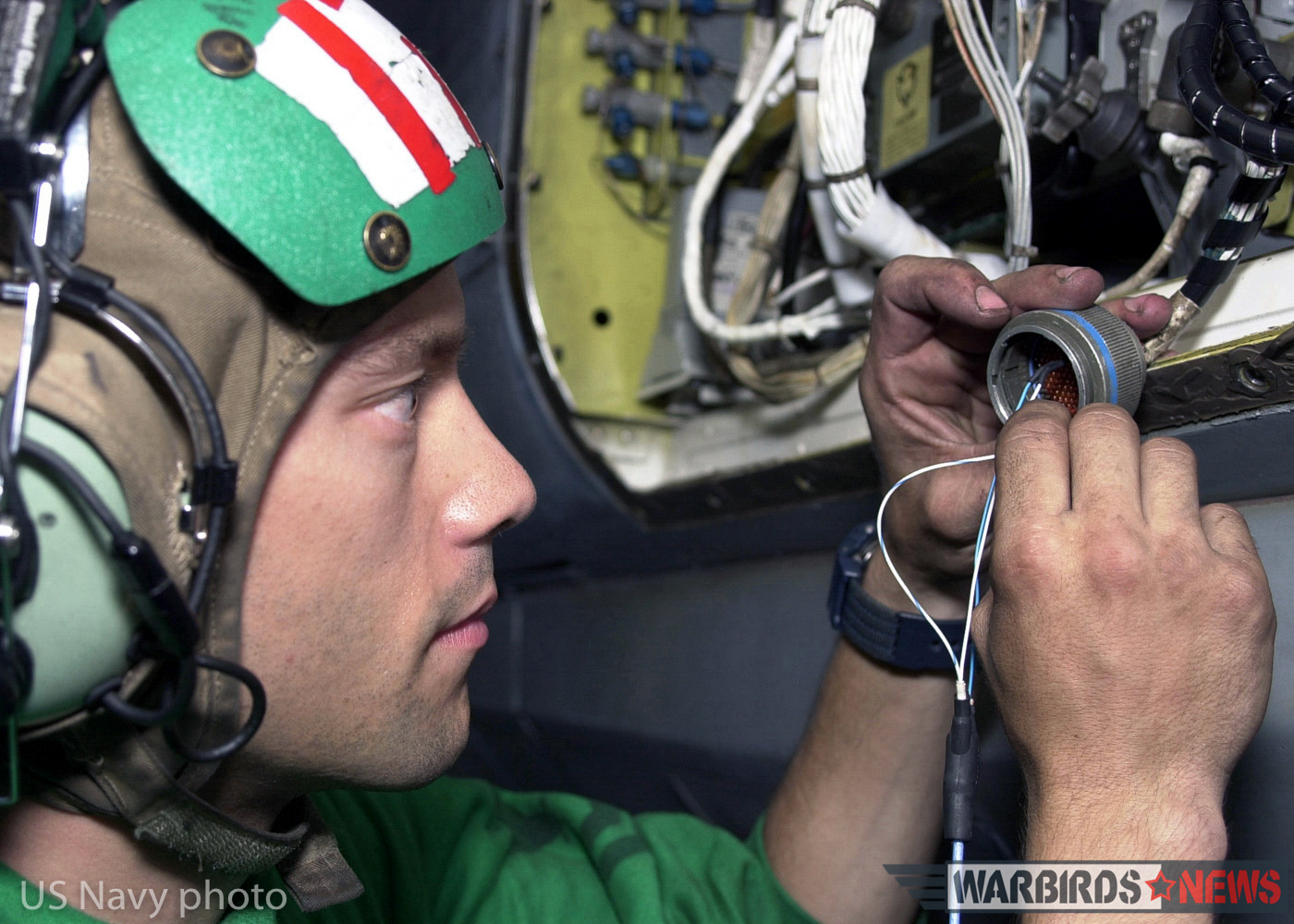 At sea aboard USS Abraham Lincoln (Oct. 18, 2002) -- Aviation Electronic's Technician 2nd Class Tony Komljenovich from Cleveland, Ohio, assigned to Fighter Squadron Thirty-One (VF-31) troubleshoots the wires on a cannon plug of an F-14D “Tomcat.” This maintenance is performed to ensure that the APG-71 radar system aboard the aircraft is working properly. The APG-71 radar is a digital processing system that gives the F-14D improved detection and tracking range. It features a low-sidelobe antenna, a sidelobe-blanking guard channel, and monopulse angle tracking, all of which are intended to make the radar less vulnerable to jamming. Lincoln and her embarked Carrier Air Wing Fourteen (CVW-14) are on a scheduled six month deployment conducting combat missions in support of Operation Enduring Freedom. U.S. Navy photo by Photographer's Mate 2nd Class Virginia K. Schaefer. (RELEASED)