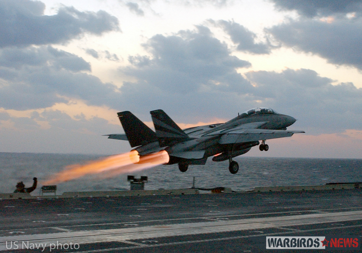At sea aboard USS Kitty Hawk (CV 63) Nov. 14, 2002 -- An F-14 “Tomcat” assigned to the “Black Knights” of Fighter Squadron One Five Four (VF-154) launches past steaming catapults on the bow of the ship. After an aircraft launches, steam is released as catapult pressure subsides. Kitty Hawk is the Navy’s only permanently forward-deployed aircraft carrier and operates out of Yokosuka, Japan. U.S. Navy photo by Photographer’s Mate 3rd Class Todd Frantom. (RELEASED)