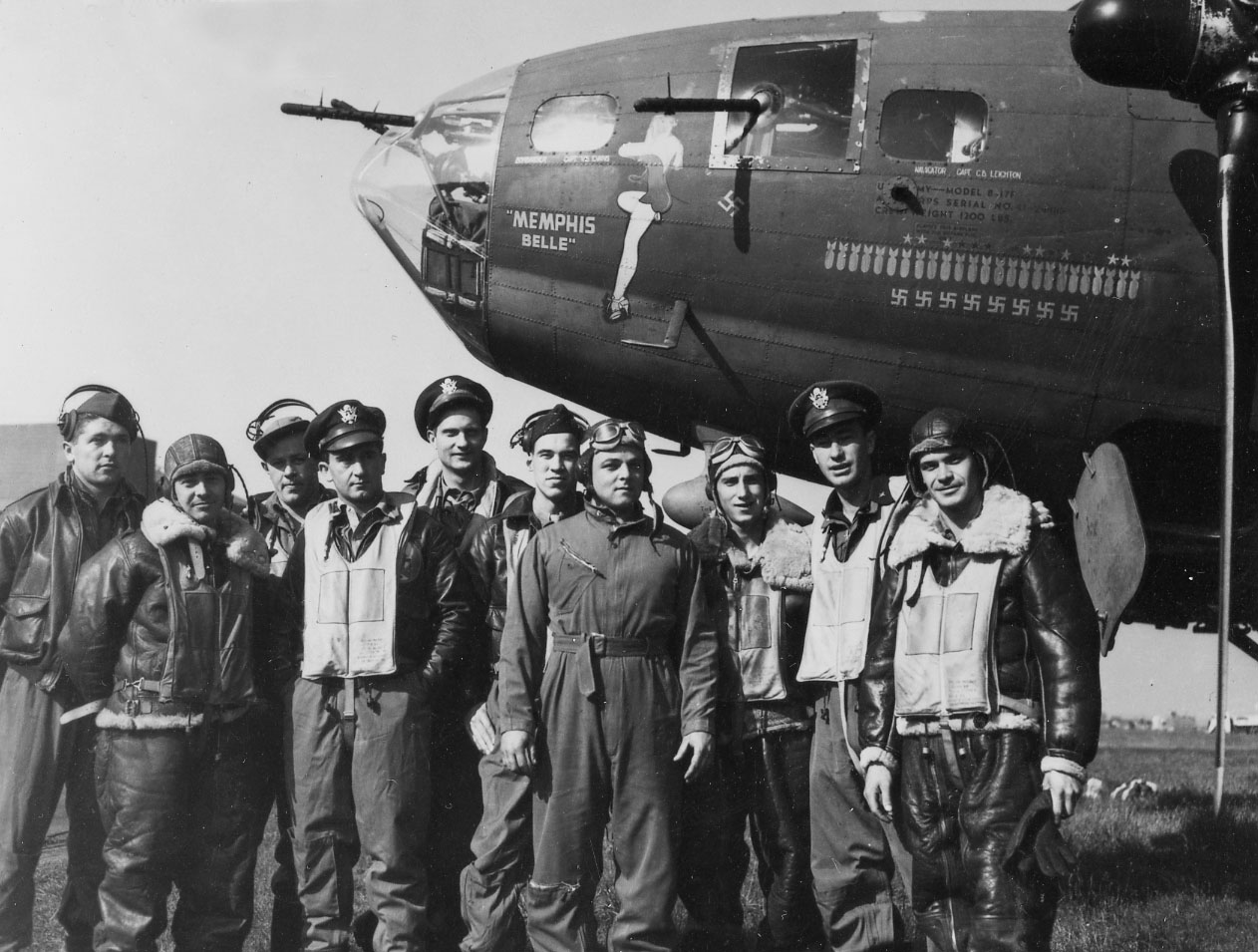 The crew of the "Memphis Belle"® after their 25th mission: (l to r) TSgt. Harold Loch (top turret gunner/engineer), SSg.t Cecil Scott (ball turret gunner), TSgt. Robert Hanson (radio operator), Capt. James Verinis (copilot), Capt. Robert Morgan (pilot), Capt. Charles Leighton (navigator), SSgt. John Quinlan (tail gunner), SSgt. Casimer Nastal (waist gunner), Capt. Vincent Evans (bombardier), and SSgt. Clarence Winchell (waist gunner). (U.S. Air Force photo) Gen. Hap Arnold, commander of the U.S. Army Air Forces, examining the "Mempis Belle" after it returned to the United States. (U.S. Air Force photo) 