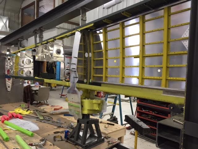 The wing structure coming together in its jig in December, 2015. (photo via AirCorps Aviation)