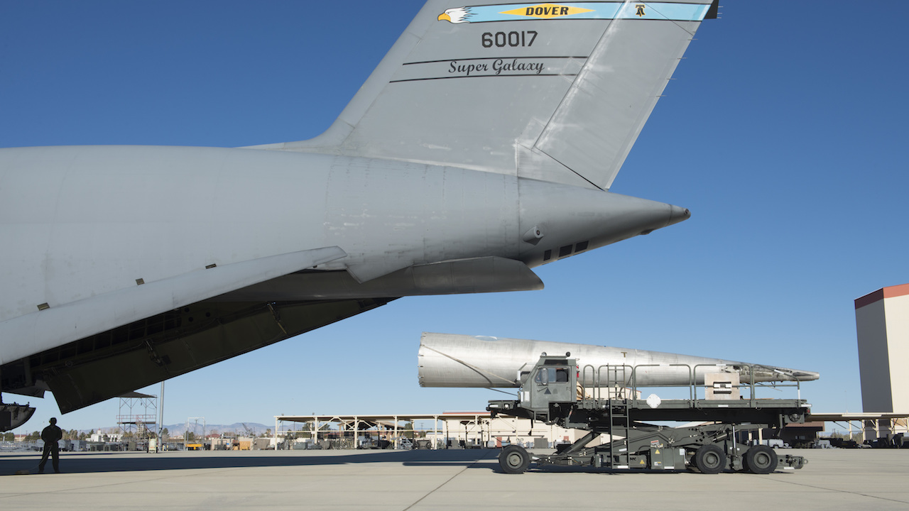 A tail-boom from the Fairchild C-119B Flying Boxcar #48-0352 “Am Can Co Special” is loaded into a C-5M Super Galaxy Dec. 19, 2016, at Edwards Air Force Base, Calif. This C-119 airdropped mobile bridge sections during the Battle of Chosin Reservoir during the Korean War. (U.S. Air Force photo by Senior Airman Zachary Cacicia)