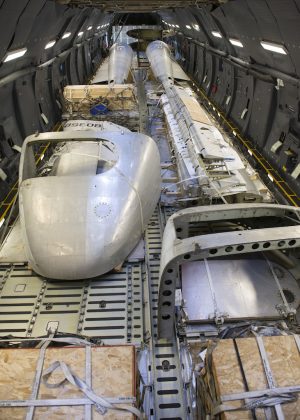 Portions of the Fairchild C-119B Flying Boxcar #48-0352 “Am Can Co Special” sit inside a C-5M Super Galaxy’s cargo bay during a mission to bring it to the Air Mobility Command Museum Dec. 19, 2016, at Edwards Air Force Base, Calif. These aircraft portions weighed around 23,000 pounds. (U.S. Air Force photo by Senior Airman Zachary Cacicia)