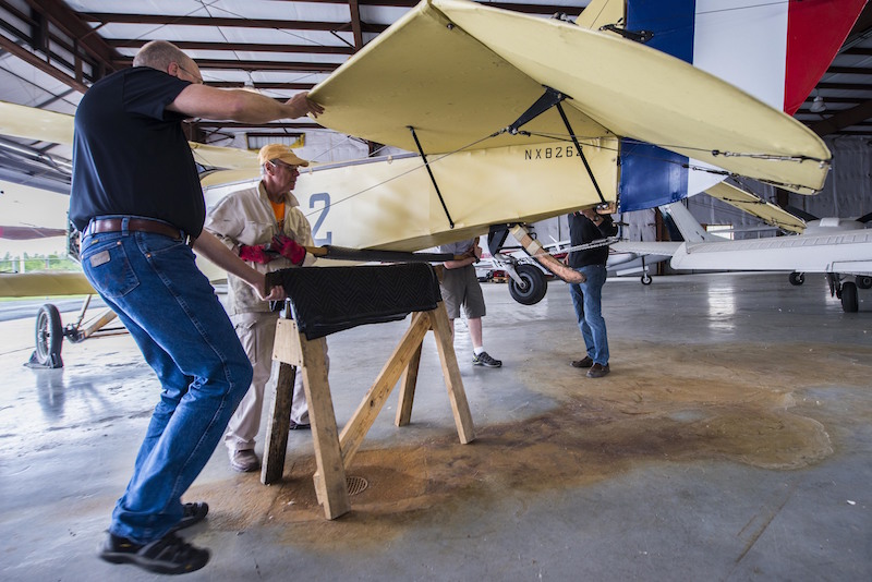 Members of Friends of Jenny perform rountine maintenace on the J-4 Jenny, May, 4, 2017 at Bowling Green, Kentucky. Other than the fact it was the first training plane, in 1917 Congress made the largest single appropriation in the United States, 640 million dollars to build an Air Force because at that point there were around 32 airplanes, in which, 10 or 12 were serviceable. (U.S. Air Force photo/Senior Airman Tristin English)