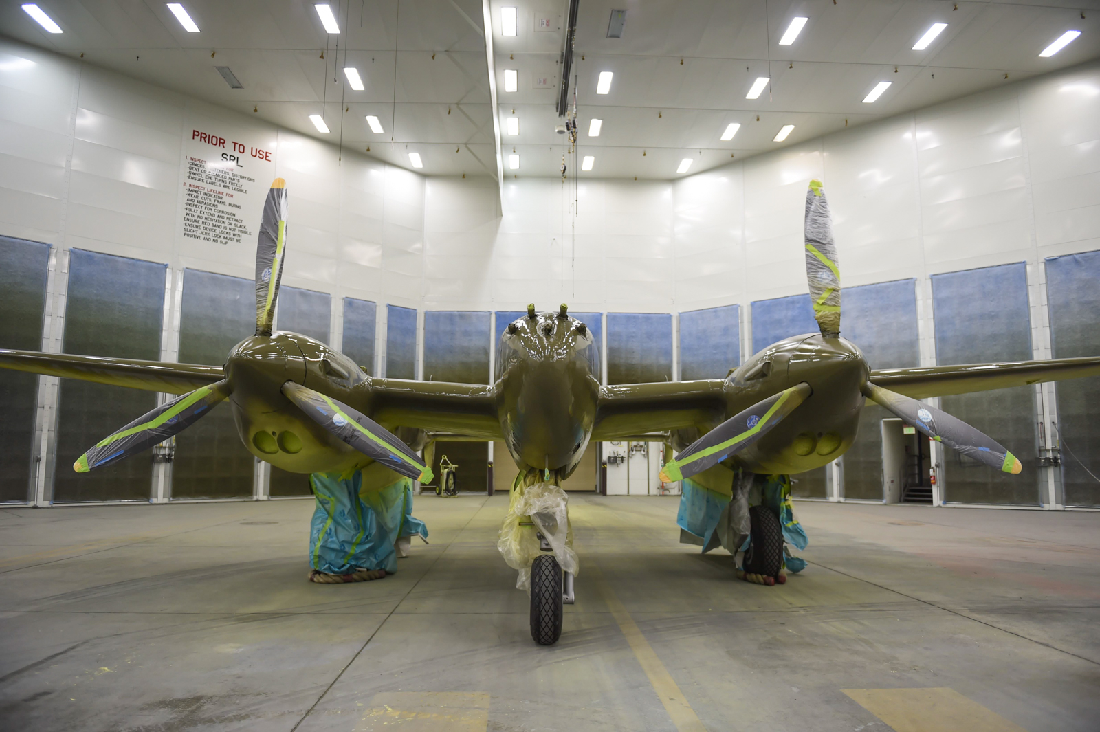 The P-38G Lightning sits inside Hangar 21 at Joint Base Elmendorf-Richardson, Alaska, July 20, 2017. The Lightning has been under restoration since August 2016. This particular P-38 saw action in World War II with the 54th Fighter Squadron in the Aleutians, where it crashed on Attu Island on Jan. 1, 1945. The P-38G Lightning is the only G model in existence and is one of fewer than 30 P-38s remaining in the world. (Photo By: Staff Sgt. Sheila deVera)
