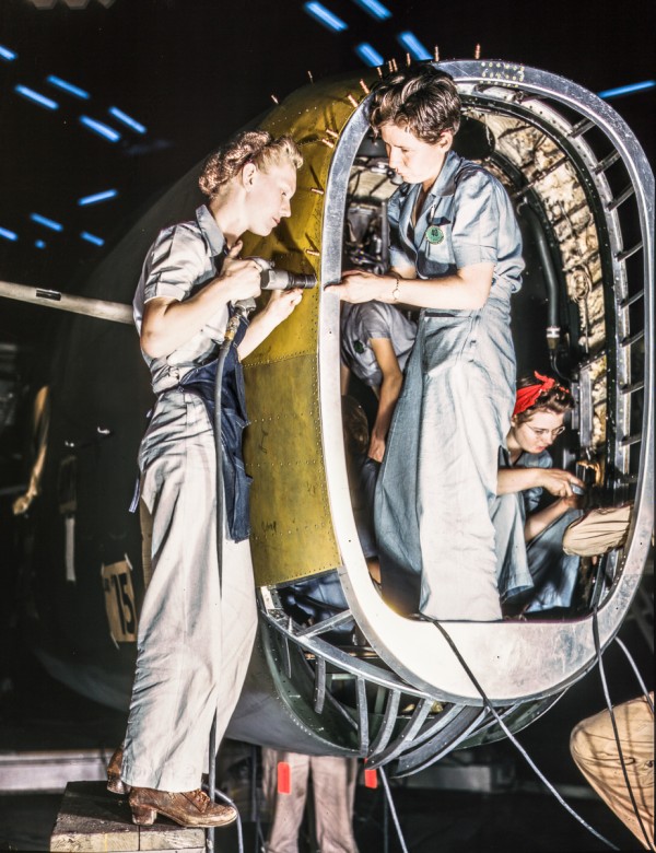 Riveters at work on fuselage of Liberator Bomber, Consolidated Aircraft Corp., Fort Worth, Texas. (photo by Howard R. Hollem)