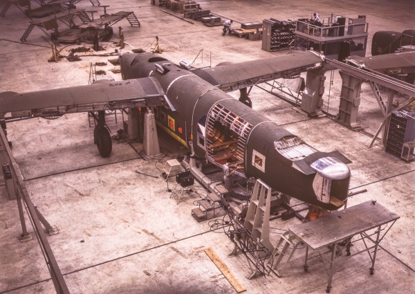 A mating operation on a transport plane just before it comes to the pre-assembly line at the Consolidated Aircraft Corporation plant, Fort Worth, Texas. (Howard R. Hollem photo)