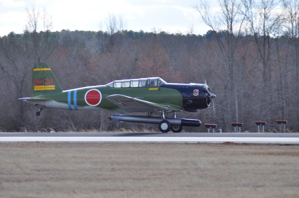 1943 SNJ-4 "Kate" bomber taking off from Falcon field in Peachtree City, GA. 