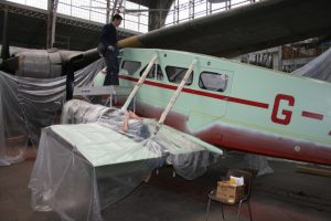  Dragon Rapide receiving its Lancashire Aircraft Corporation paint scheme