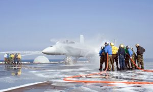 Crash and salvage teams spray an aircraft during a training exercise aboard the aircraft carrier USS George Washington (CVN 73) (Image Credit: US Navy)