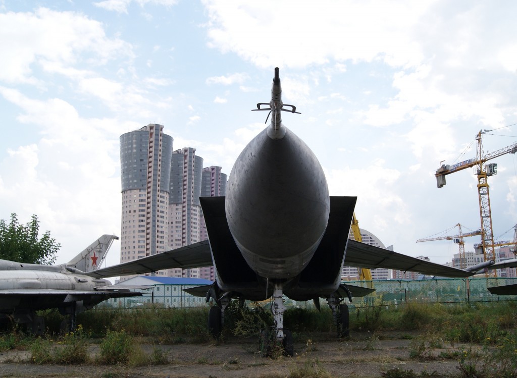 As in many of the photgraphs here, construction and development looms ominously behind this Mikoyan-Gurevich MiG-25 (Image Credit: Sergey Rodovnichenko, CC 3.0) 