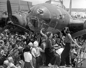Aug. 19, 1943: Throngs of female aircraft workers signing their names on the B-17 bomber Memphis Belle in Long Beach, California (Image Credit: Los Angeles Daily News Archive/ UCLA)