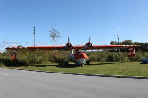 Consolidated PBY Canso water bomber in the distinctive orange and green livery of the Government of Newfoundland and Labrador. (Image Credit: NAAM)