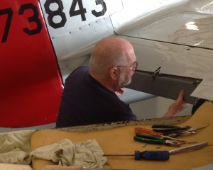 CAF Dixie Wing's Maintenance Officer works on Red Nose's elevator trim tabs. (Image Credit: CAF Dixie Wing)
