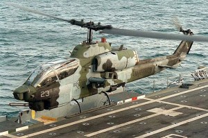 USMC Bell AH-1W Super Cobra attack helicopter taking off from an amphibious assault ship. (Image Credit: USMC)