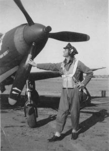 2nd Lieutenent James Johnson with his previous ride, a Bell P-39 Airacobra