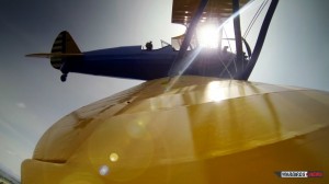 GoPro attached to the right wing tip of the Stearman piloted by Stefano Landi provides dramatic view during flight. (Image Credit: Luckyplane.it)