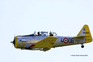 il Tricolore is waved from the rear seat of the ex-Italian Air Force T-6 Texan. (Image Credit: Paolo Franzini)