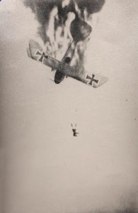 German pilot bails from his stricken plane (Image Credit: Noble Numismatics)
