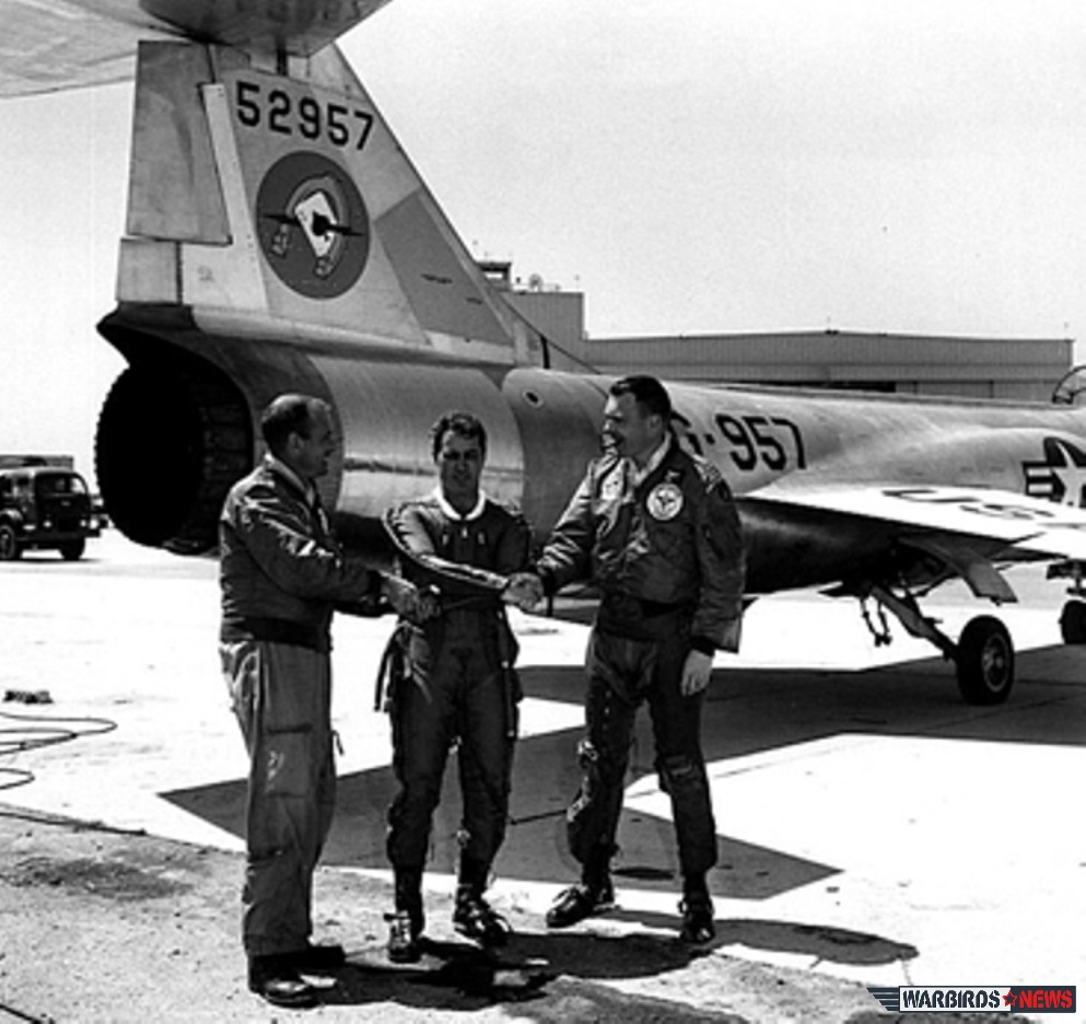 Test pilots Walt Irwin and Jim Low congratulate "Scrappy" after his record-setting flight.