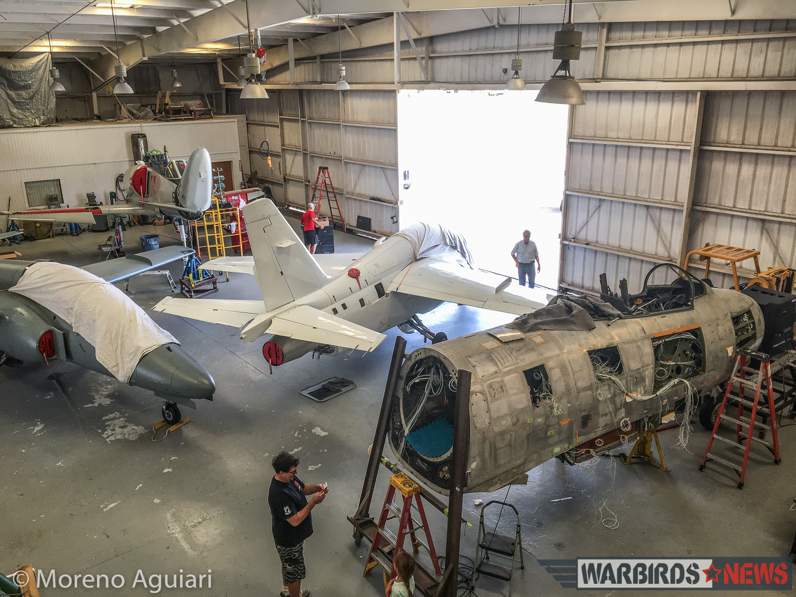 Classic Fighters of America's second F-86 Sabre is slowly coming together in the right foreground. The two already airworthy S.211s are in the middle, while the forward TA-4J is in the far back. (photo by Moreno Aguiari)