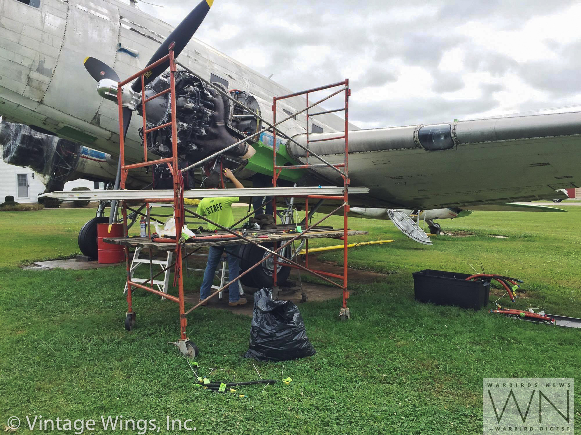 Scaffolding surrounds Beach City Baby's port engine as the crew works on it. (photo via Vintage Wings, Inc.)