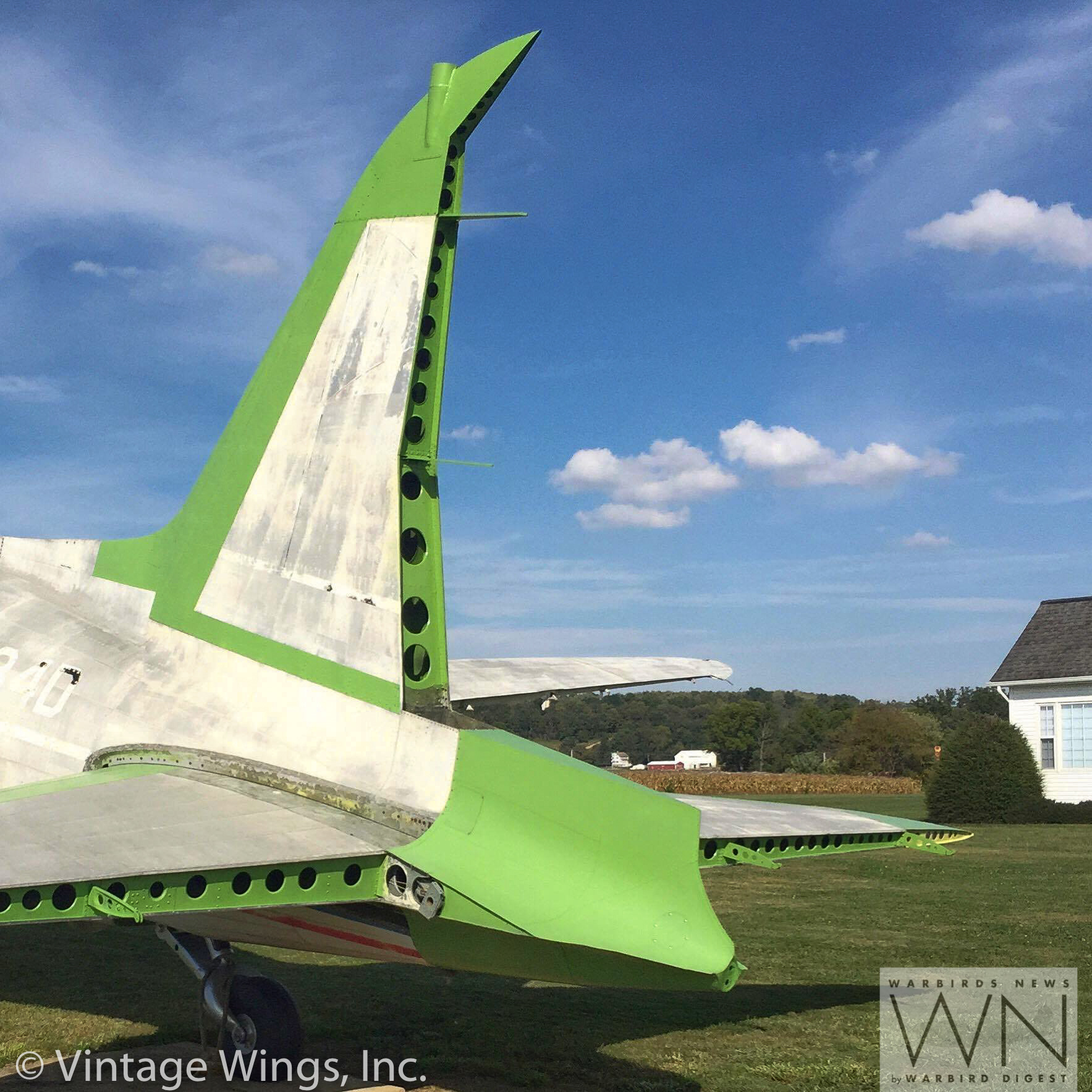 Work to restore the empennage is clearly evident in this image. Everything painted in green primer has been renewed. (photo via Vintage Wings, Inc.)