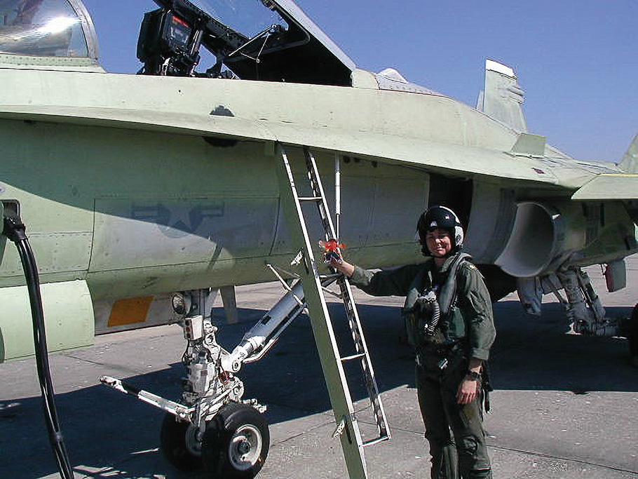 Kim Dyson prepares to fly a functional check flight in an aircraft that has just had its center sectionreplaced. Once an aircraft passes a check flight, maintenance teams will paint over the green primer
before releasing the airplane back to its squadron.