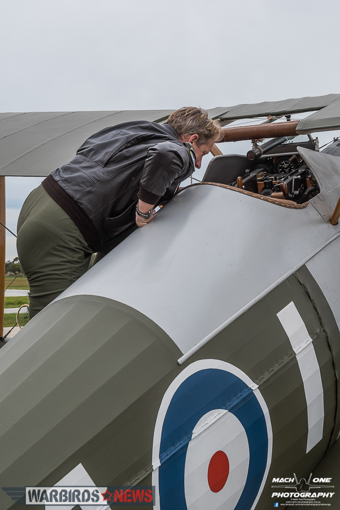 Flt.Lt.Burrows inspecting the spartan cockpit of the Sopwith Snipe. (photo by Matt Savage)