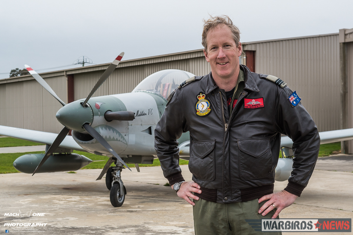 Lt.Col. Col Burrows in front of his Pilatus PC-9. (photo by Matt Savage)