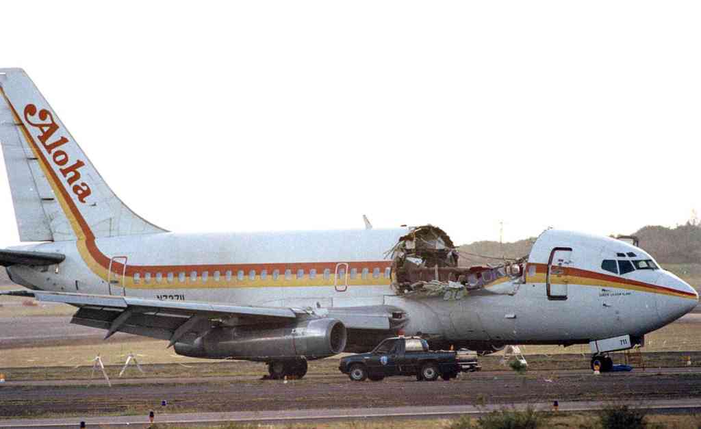 Aloha Airlines Boeing 737 (-200 Series) on the tarmac of Kahului Airport (OGG) in 1988. The major structural failure killed one flight attendant, severely injured several passengers, and caused the flight crew to make an emergency diversion and landing at OGG. [Photo Credit: Wikipedia]