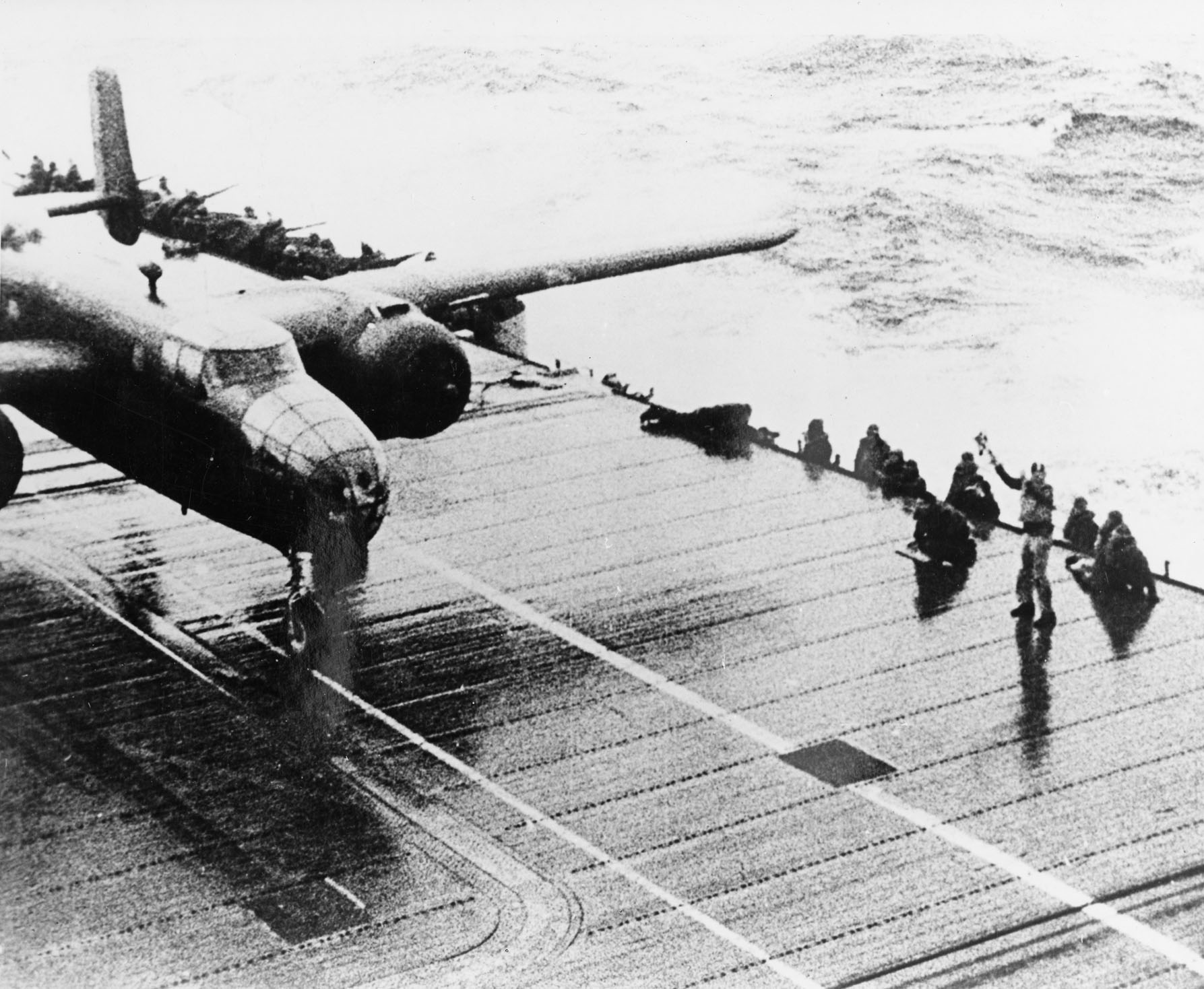  The aircraft carrier Hornet had 16 AAF B-25s on deck, ready for the Tokyo Raid. (U.S. Air Force photo) 4 of 4 DOWNLOAD HI-RES / PHOTO DETAILS The aircraft carrier Hornet had 16 AAF B-25s on deck, ready for the Tokyo Raid. (U.S. Air Force photo) DAYTON, Ohio -- Lt. Col. Richard “Dick” E. Cole, who served as Jimmy Doolittle’s co-pilot on Crew No. 1. Cole, now 101 years old, plans to return to the National Museum of the U.S. Air Force in April to commemorate the 75th anniversary of the raid. (U.S. Air Force photo by Jeff Fisher) 1 of 4 DOWNLOAD HI-RES / PHOTO DETAILS DAYTON, Ohio -- Lt. Col. Richard “Dick” E. Cole, who served as Jimmy Doolittle’s co-pilot on Crew No. 1. Cole, now 101 years old, plans to return to the National Museum of the U.S. Air Force in April to commemorate the 75th anniversary of the raid. (U.S. Air Force photo by Jeff Fisher) On 18 April 1942, airmen of the US Army Air Forces, led by Lt. Col. James H. (Jimmy) Doolittle, carried the Battle of the Pacific to the heart of the Japanese empire with a surprising and daring raid on military targets at Tokyo, Yokohama, Yokosuka, Nagoya, and Kobe. This heroic attack against these major cities was the result of coordination between the Army Air Forces and the US Navy, which carried the sixteen North American B-25 medium bombers aboard the carrier USS Hornet to within take-off distance of the Japanese Islands. Here, a pair of alert escorts follow the USS Hornet to protect her lethal cargo of B-25 bombers. (U.S. Air Force Photo) 2 of 4 DOWNLOAD HI-RES / PHOTO DETAILS On 18 April 1942, airmen of the US Army Air Forces, led by Lt. Col. James H. (Jimmy) Doolittle, carried the Battle of the Pacific to the heart of the Japanese empire with a surprising and daring raid on military targets at Tokyo, Yokohama, Yokosuka, Nagoya, and Kobe. This heroic attack against these major cities was the result of coordination between the Army Air Forces and the US Navy, which carried the sixteen North American B-25 medium bombers aboard the carrier USS Hornet to within take-off distance of the Japanese Islands. Here, a pair of alert escorts follow the USS Hornet to protect her lethal cargo of B-25 bombers. (U.S. Air Force Photo) 