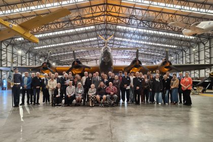 77 squadron association in front of halifax bomber