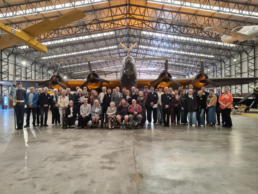 77 squadron association in front of halifax bomber
