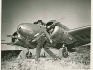8 Amelia Earhart walking in front of her Lockheed Electra 10E courtesy Purdue University Libraries