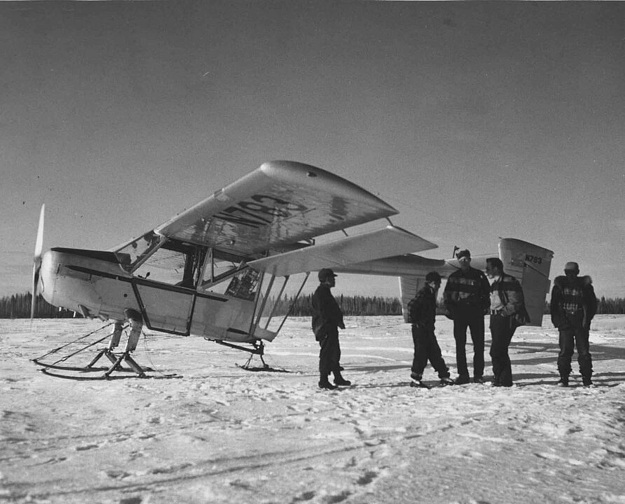 892px Pilot and crew members with plane