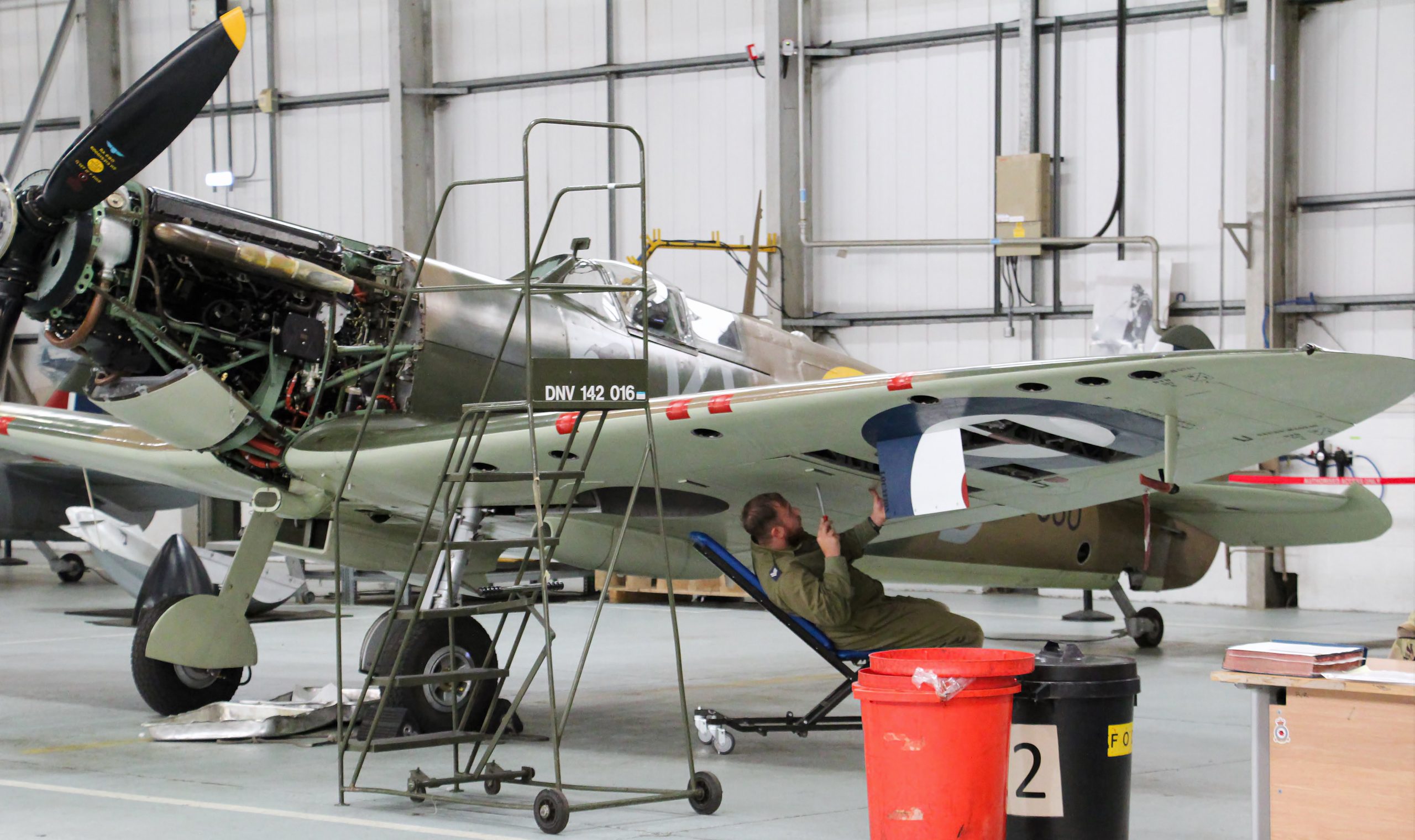 A BBMF corporal removing underwing panels from Spitfire IIa P7350. Photo Clive Rowley scaled