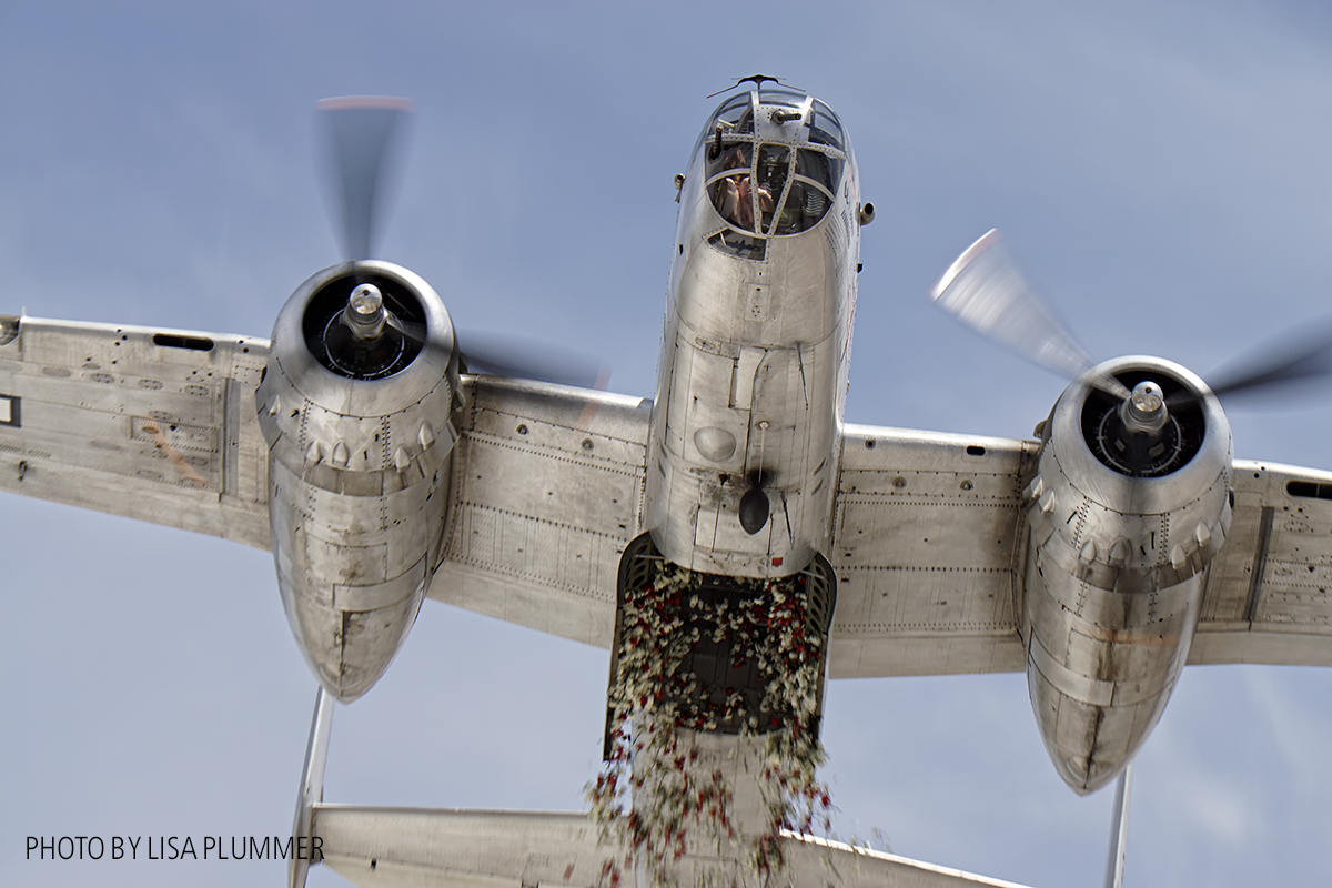 Aero Trader own B-25 piloted by Carl Scholl dropping 3000 carnations from the bomb bay. ( photo by Lisa Plummer)