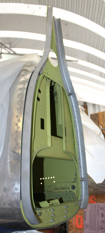 The still unfinished attach angles for vertical stabilizers (in gray) on the rear fuselages. (photo via Tom Reilly)