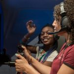 After learning aeronautics and aviation basics plan a flight and perform preflight checkouts in a real airplane these girls take their trip on a flight simulator in the Museums Aviation Learning Center.