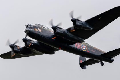 Against grey skies Lancaster PA474 departs from Coningsby to fly to Duxford on 29th October. Photo Malcolm Shorter
