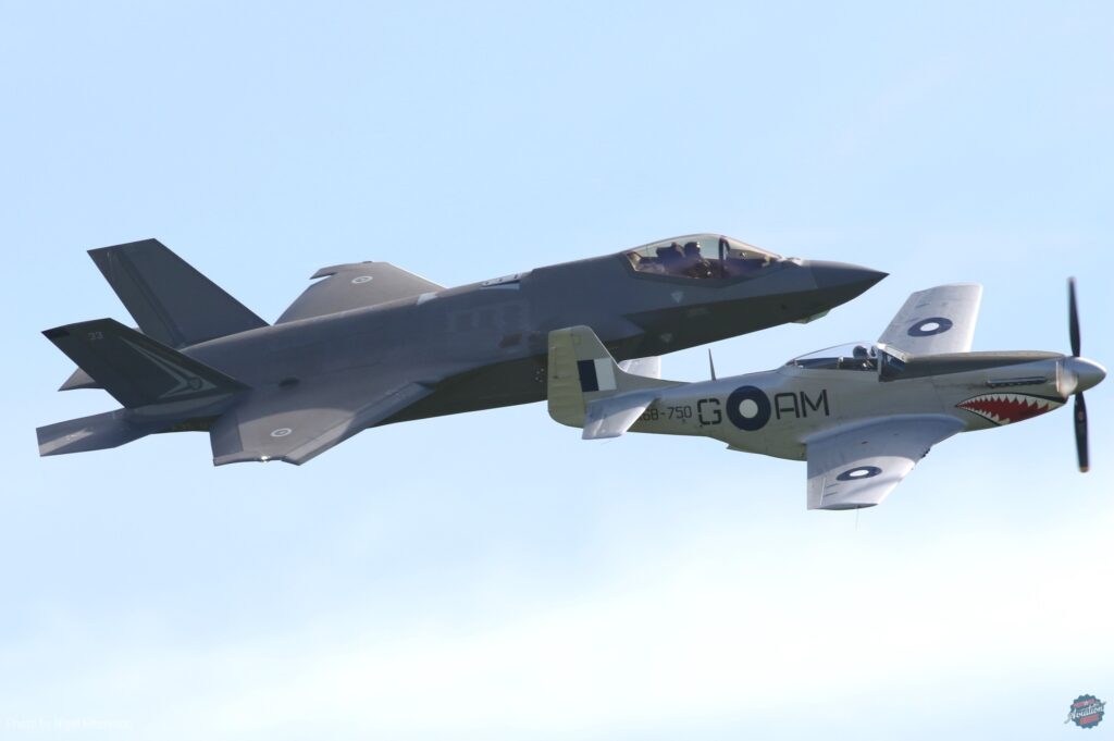 The past and future of the RAAF: 100 Sqn's CAC Mustang leads its modern counterpart, F-35A A35-33 of 2 OCU, in a heritage flypast. [Photo by Nigel Hitchman]