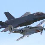 The past and future of the RAAF: 100 Sqn's CAC Mustang leads its modern counterpart, F-35A A35-33 of 2 OCU, in a heritage flypast. [Photo by Nigel Hitchman]