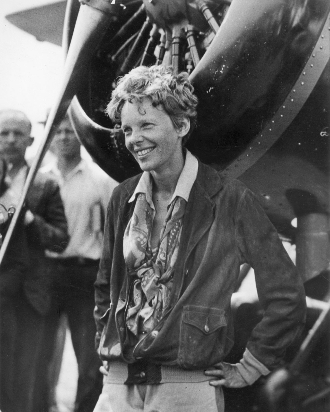 Amelia Earhart with her Lockheed Vega after her record setting solo nonstop flight across North America 25 August 1932. Encyclopedia Britannica