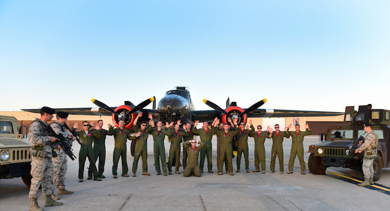 Members of the 13th Bomb Squadron (BS) pose for a reenactment photo depicting the “acquiring” of a North American B-25 Mitchell at Whiteman Air Force Base, Mo., June 11, 2017. The 13th BS celebrated 100 years of service on June 14, 2017. 75 years ago, the 13th “acquired” 24 B-25s from the Dutch Air Force during World War II. (U.S. Air Force photo by Tech. Sgt. Tyler Alexander)