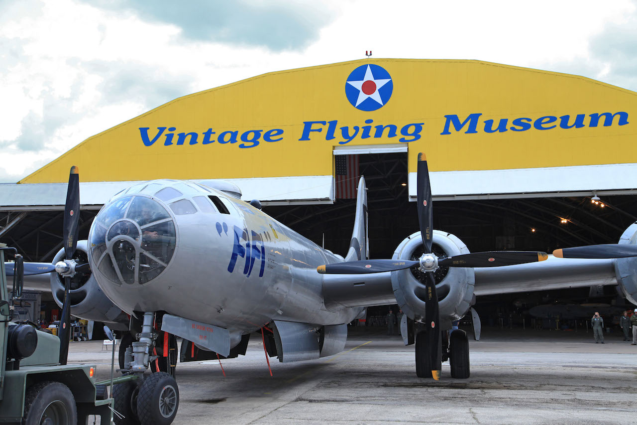 FIFI being towed  into her new home, The Vintage Flying Museum's hangar. (Photo credit to Tim Wiebe)